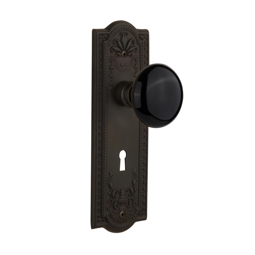 Nostalgic Warehouse MEABLK Privacy Knob Meadows Plate with Black Porcelain Knob with Keyhole in Oil Rubbed Bronze